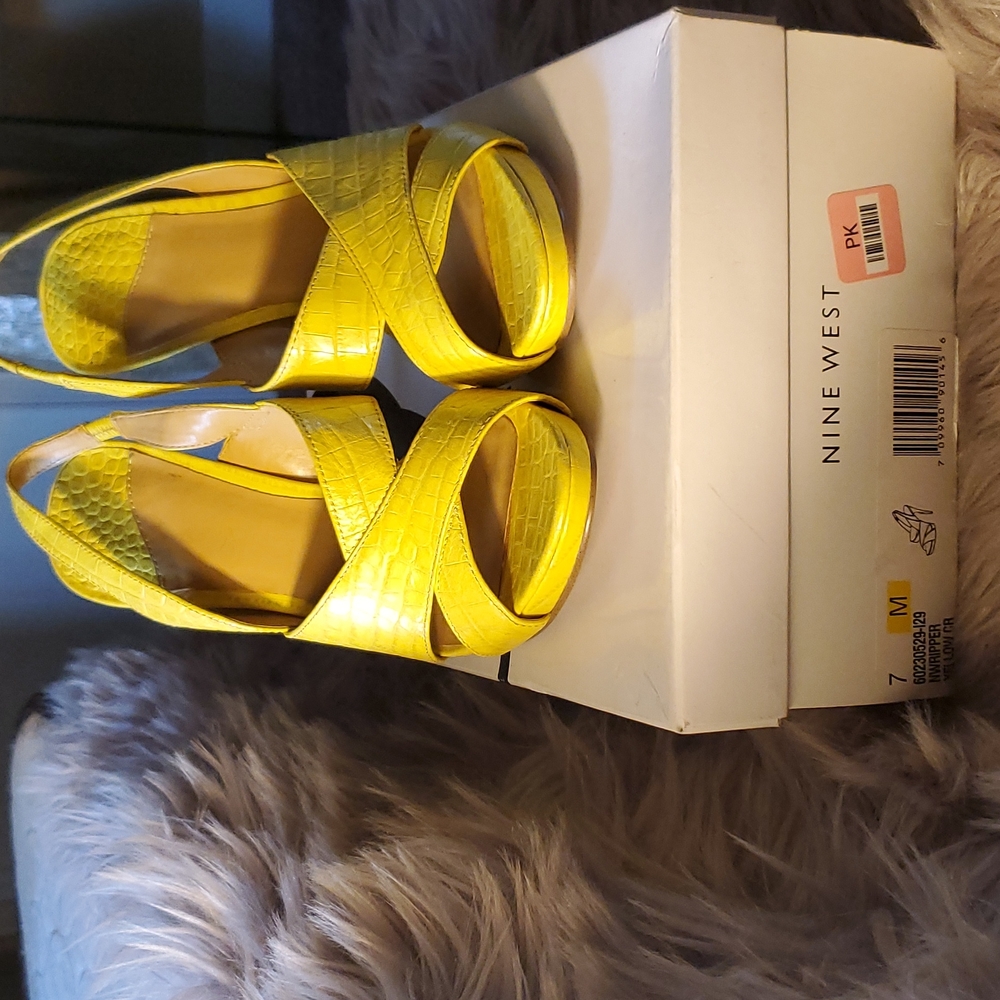 Super cute yellow 5" heels. Crocodile design size 7 with tan and yellow sole.